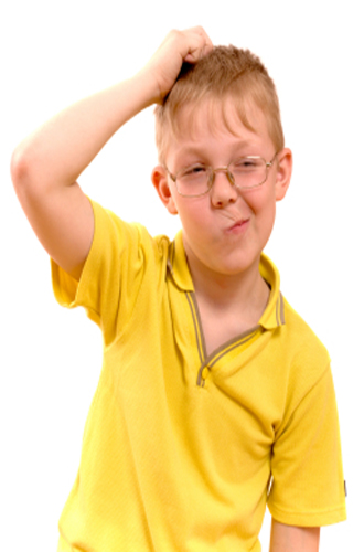 Boy scratching head
