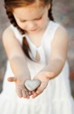 Girl gives a heart